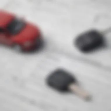 A close-up of a car key and financial documents